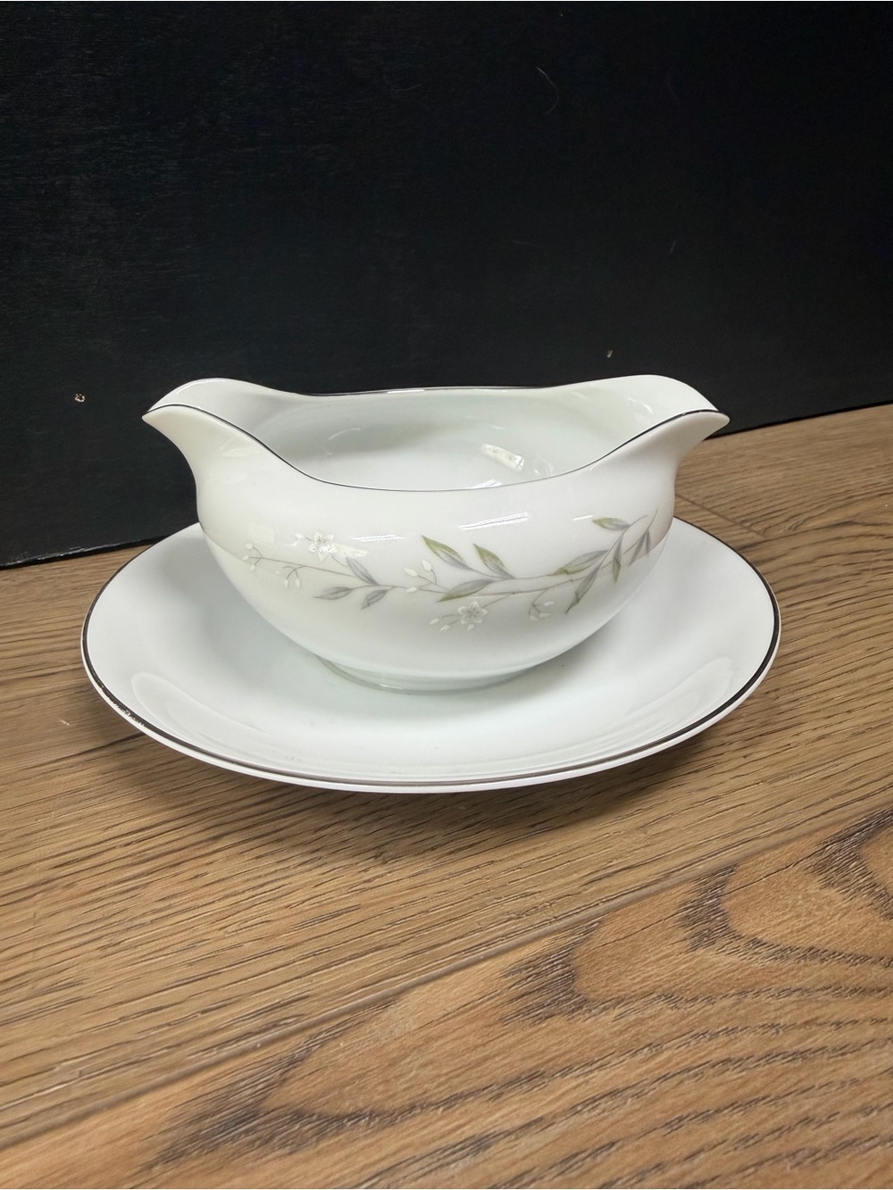 Elegant White Porcelain Gravy Boat with Soft Green Leaf Accents